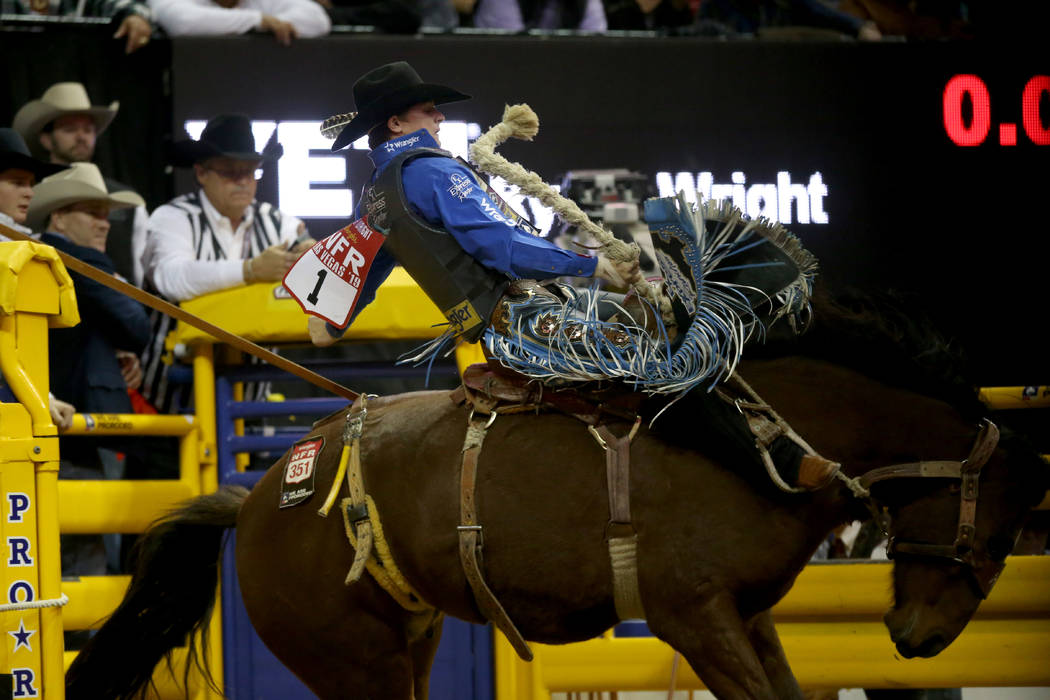 Ryder Wright of Milford, Utah rides Toma Jo in Saddle Bronc Riding during the ninth go-around o ...