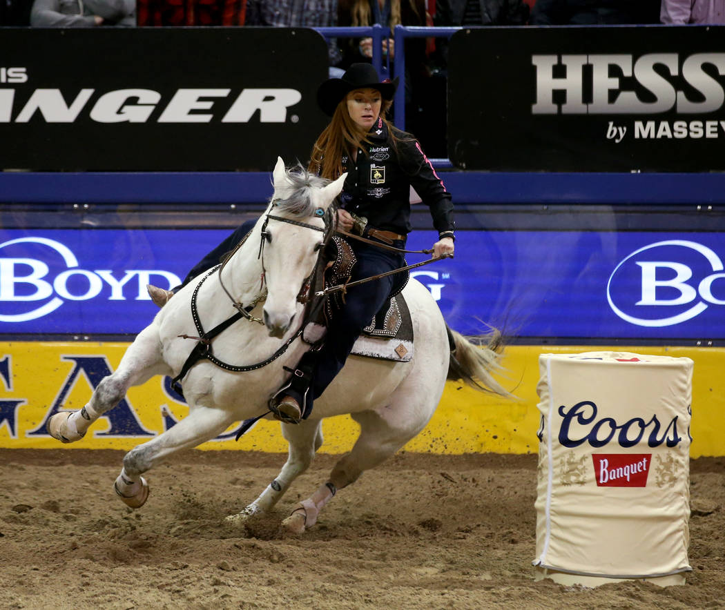 Emily Miller of Weatherford, Okla. competes in Barrel Racing during the ninth go-around of the ...