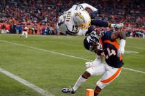 Los Angeles Chargers wide receiver Keenan Allen scores over Denver Broncos strong safety Will P ...