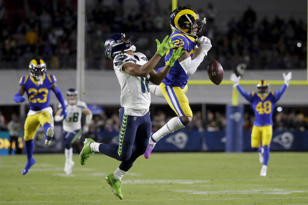 Los Angeles Rams cornerback Troy Hill breaks up a pass intended for Seattle Seahawks wide recei ...