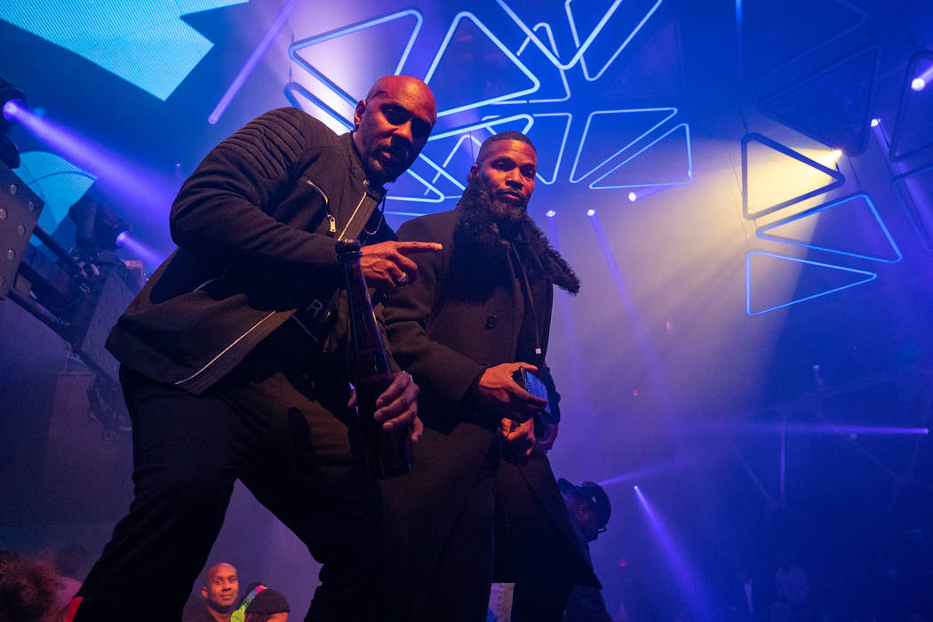 Jamie Foxx and an unidentified friend celebrate Foxx's 52nd birthday at Hakkasan Nightclub at M ...
