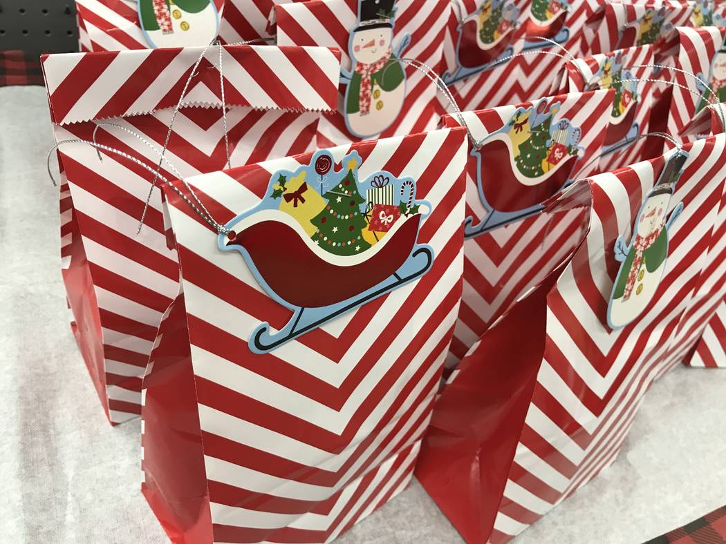 Goodie bags for children are on display during a "Santa Cops" event on Saturday, Dec. 14, 2019, ...