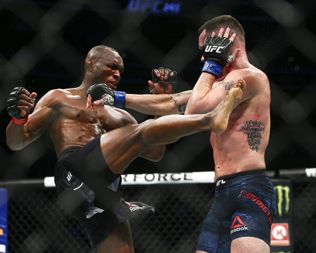 Kamaru Usman, left, fights Colby Covington during their welterweight title bout UFC 245 at T-Mo ...
