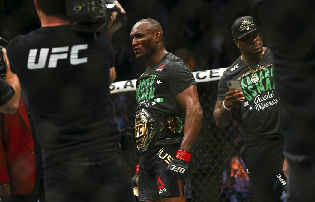 Kamaru Usman looks on after defeating Colby Covington via technical knockout in their welterwei ...