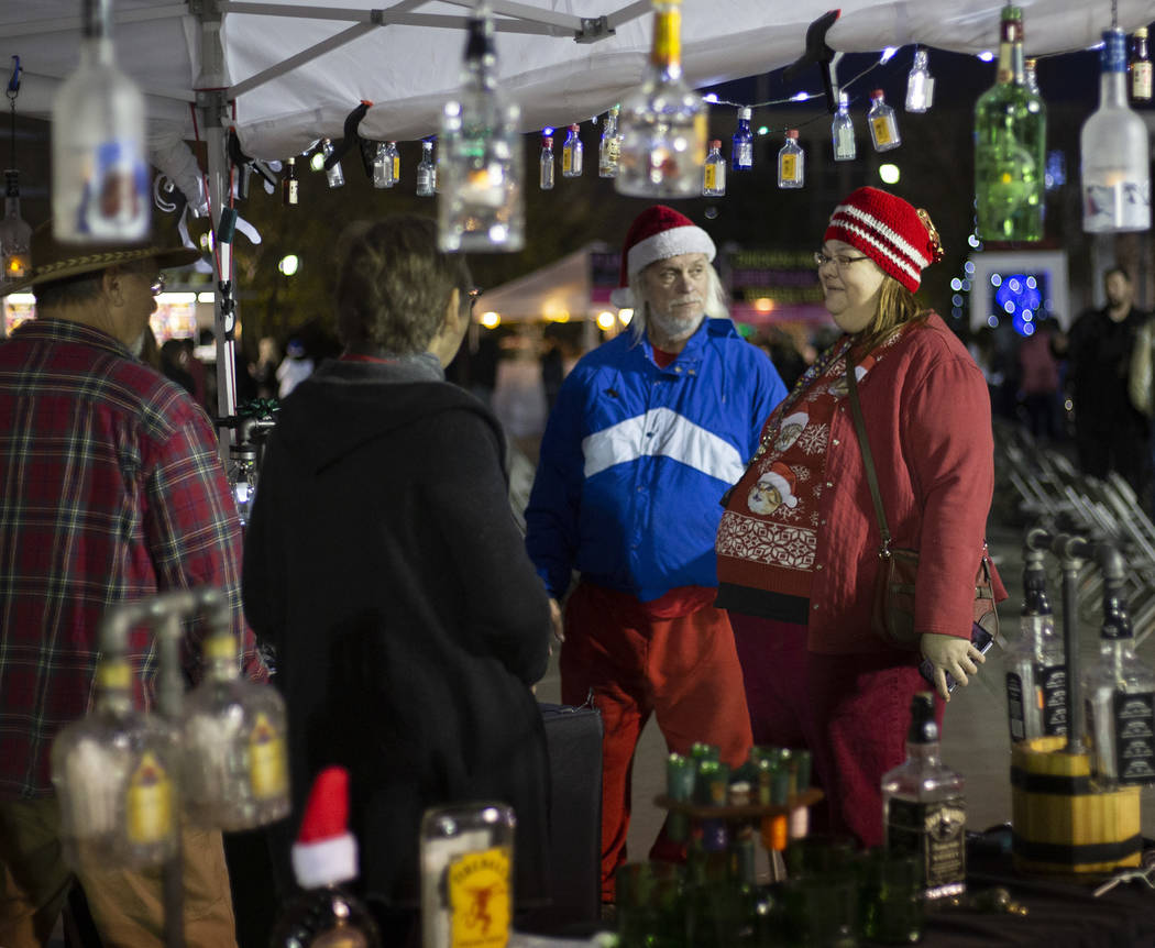 Angel Shindler and Bobby Gray, right, of Henderson, chat with Karen and Steve Dzierzewski, left ...