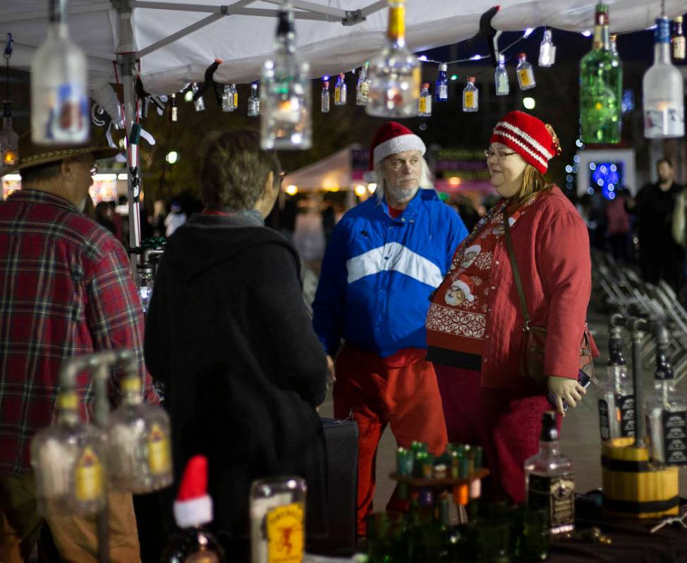 Angel Shindler and Bobby Gray, right, of Henderson, chat with Karen and Steve Dzierzewski, left ...