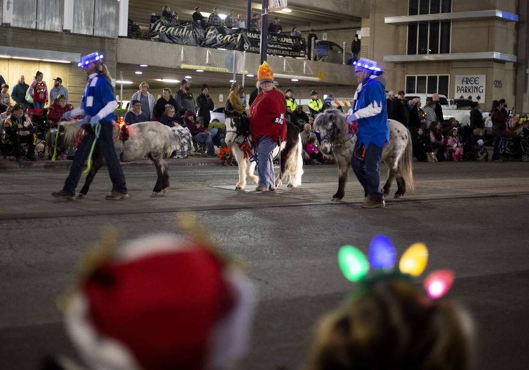 Ponies are part of the parade at Henderson's annual WinterFest on Saturday, Dec. 14, 2019, in H ...