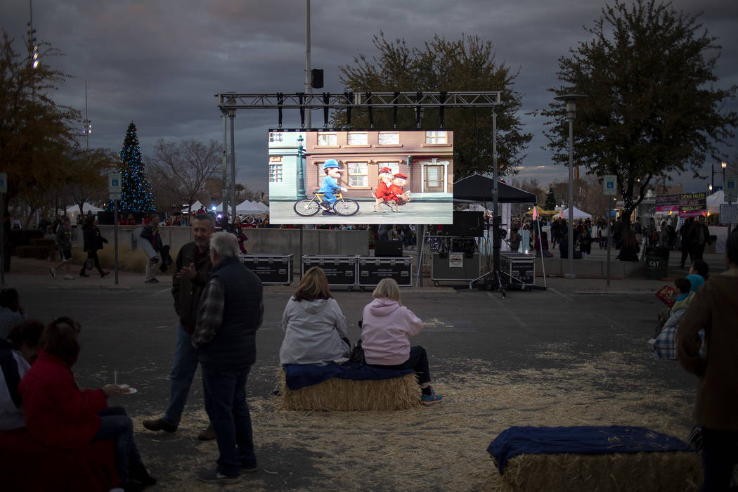 A screen plays classic holiday movies at Henderson's annual WinterFest on Saturday, Dec. 14, 20 ...