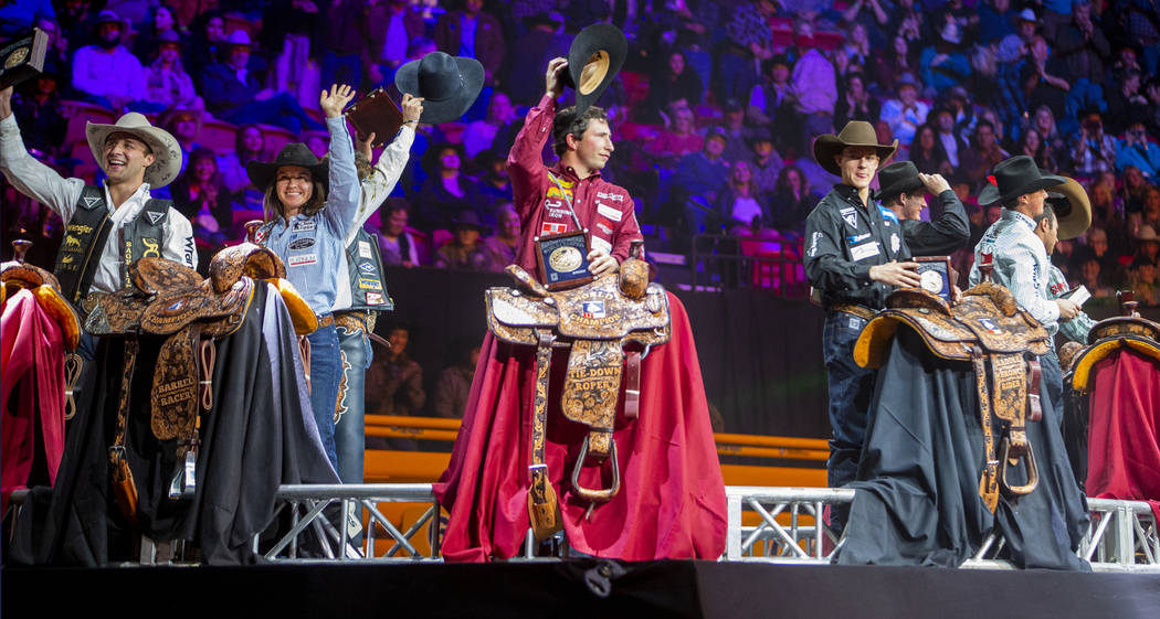 All-Around World Champion Stetson Wright of Milford, Utah, center left, stands with All-Around ...