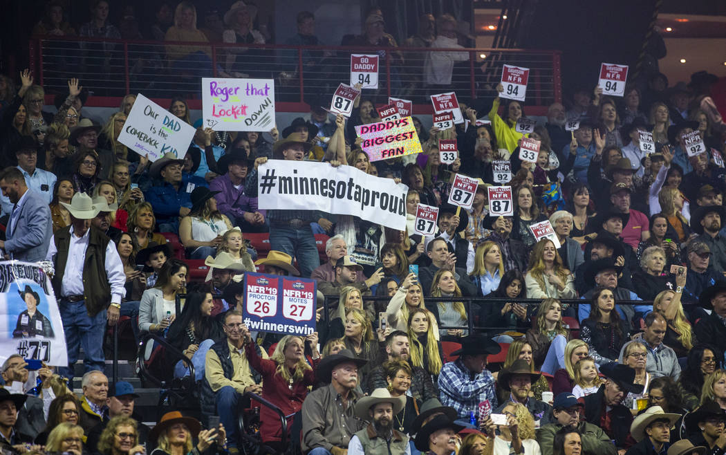 Fans cheer for their competitors during the tenth go round of the Wrangler National Finals Rode ...