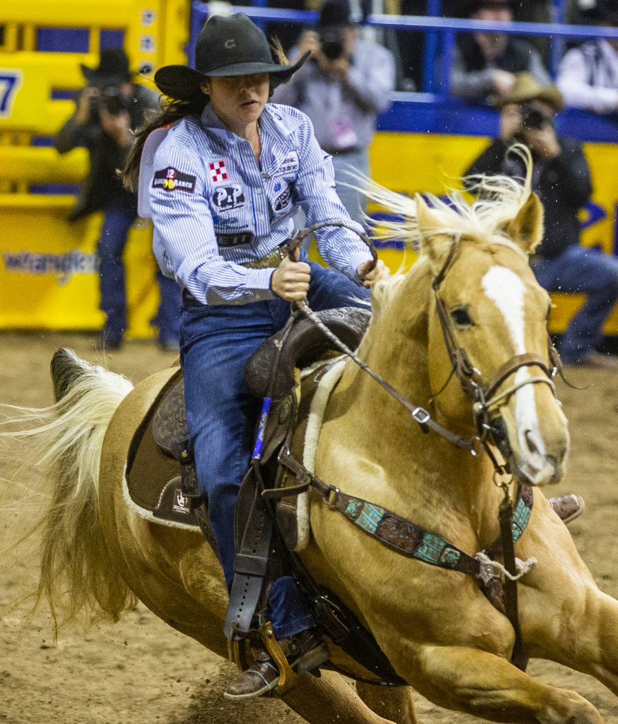 Hailey Kinsel of Cotulla, Texas, heads towards her first turn in Barrel Racing at the tenth go ...