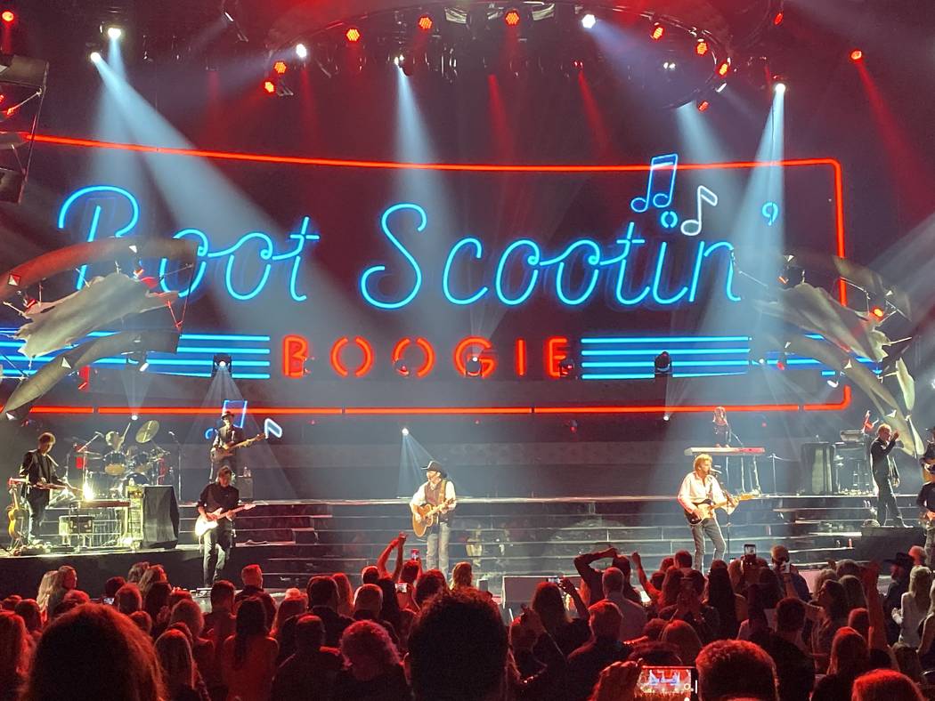 Kix Brooks and Ronnie Dunn perform "Boot Scootin' Boogie" during the Reba and Brooks & Dunn sho ...