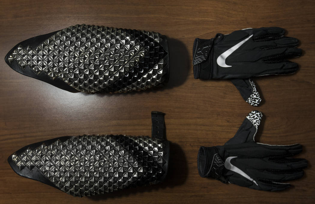 Gloves and arm bands line the counter in Wayne Mabry's hotel room at 4 a.m. in Dublin, Calif. a ...