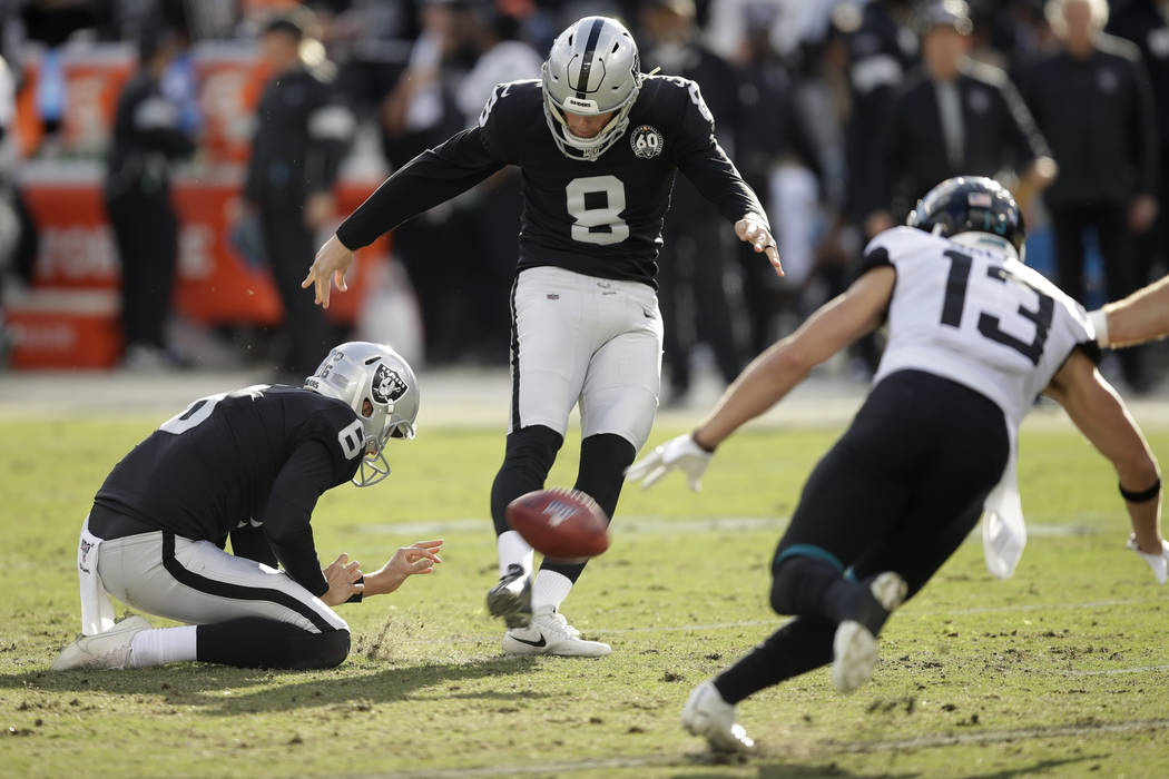 Oakland Raiders kicker Daniel Carlson (8) kicks a field goal as Jacksonville Jaguars wide recei ...