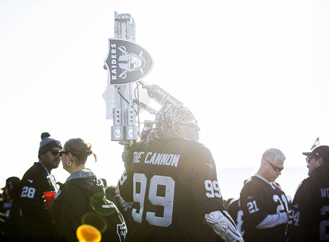 "The Cannon" tailgates outside the Oakland Coliseum before the start of an NFL footba ...