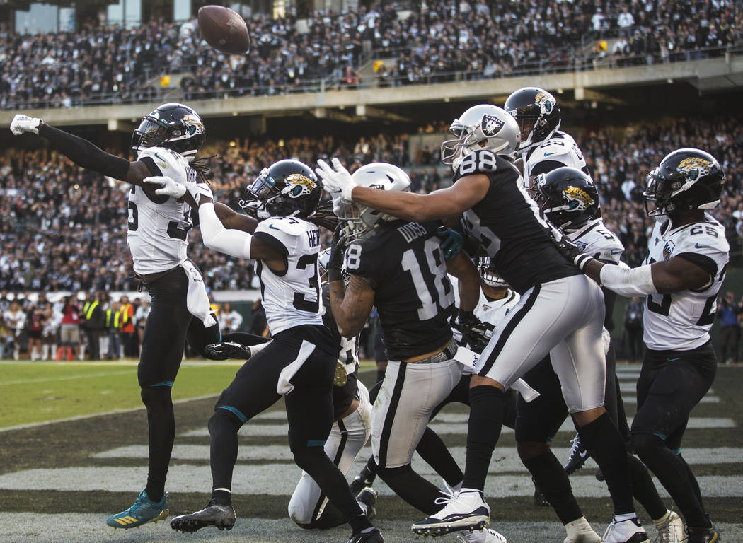 Jacksonville Jaguars strong safety Ronnie Harrison (36) and Jacksonville Jaguars cornerback Tre ...