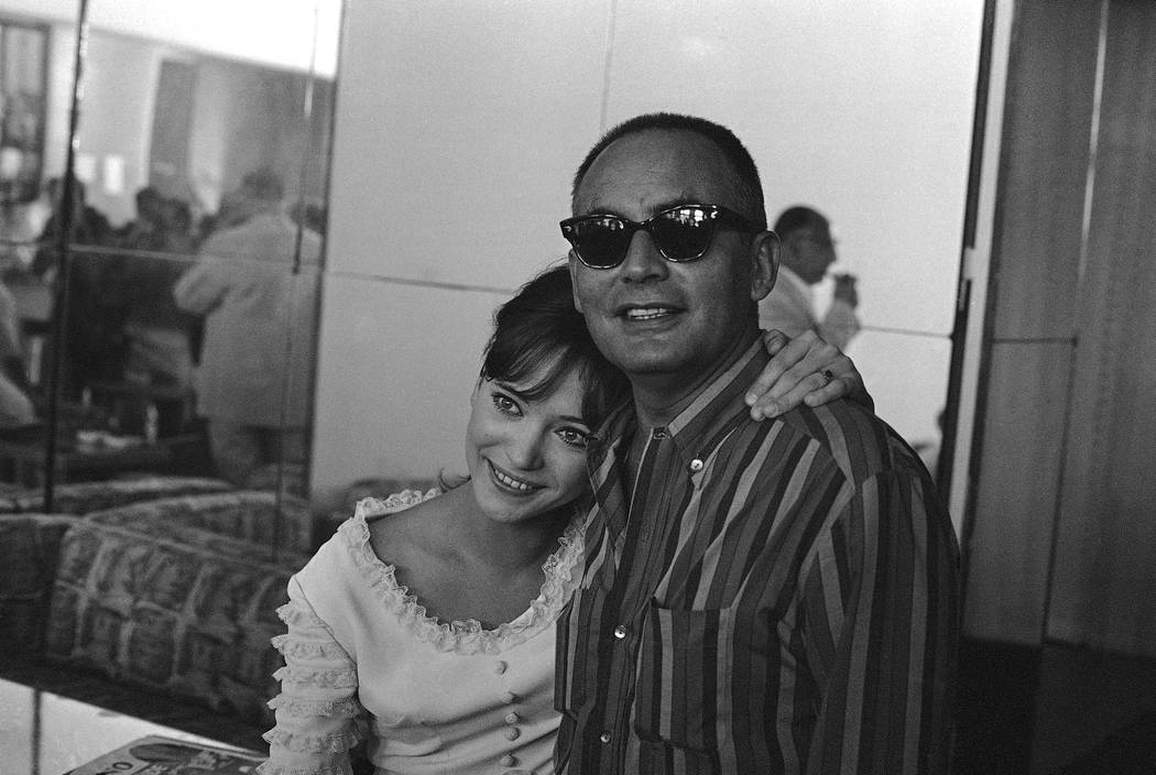 In this Aug.29 1965, file photo, French actress Anna Karina embraces Italian producer Dino De L ...