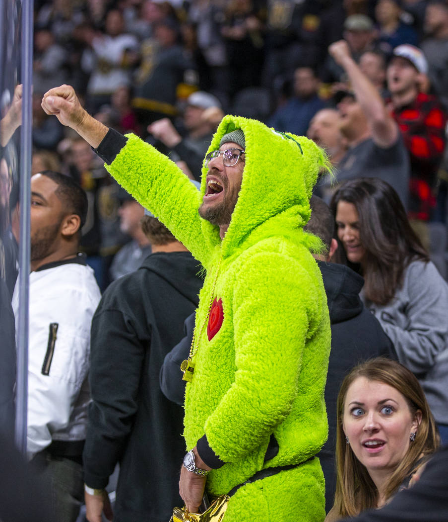 A Vegas Golden Knights fan celebrates another goal on Vancouver Canucks goaltender Jacob Markst ...