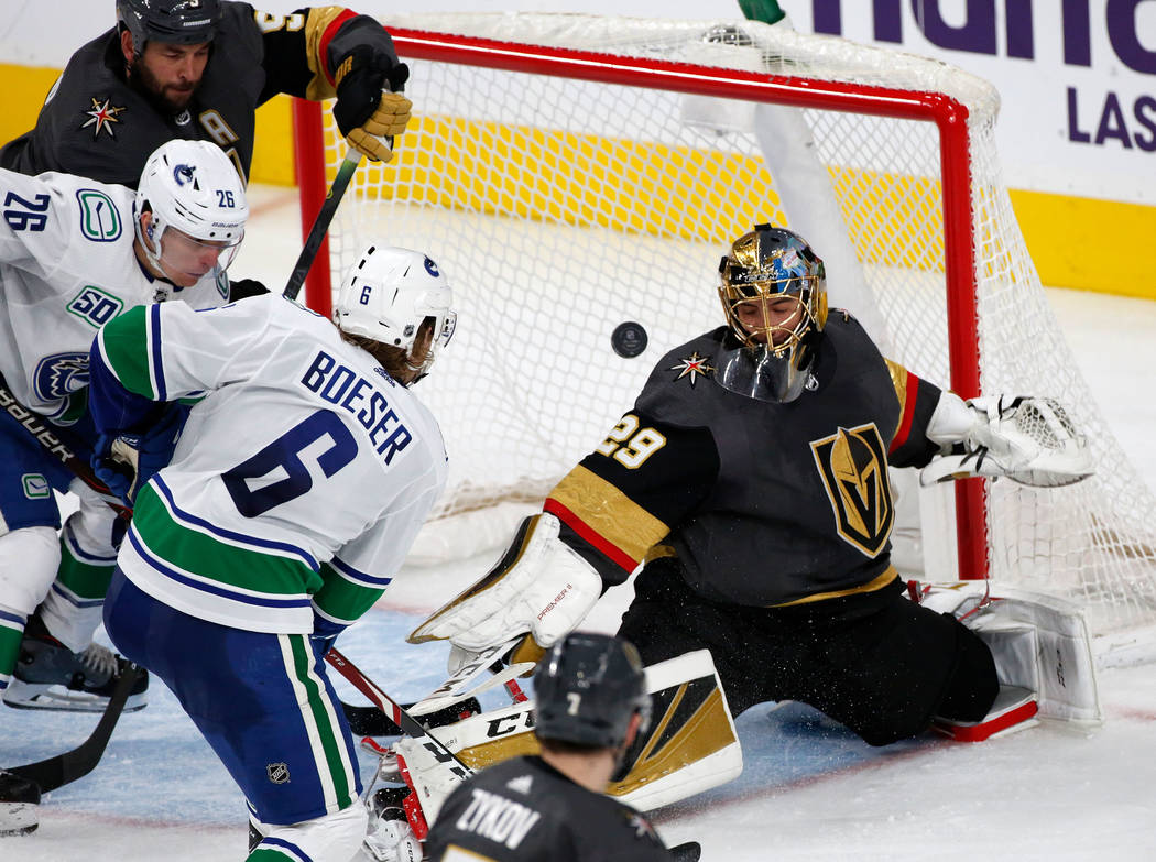 Vegas Golden Knights goaltender Marc-Andre Fleury (29) cannot stop a puck shot by Vancouver Can ...