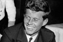In this Feb. 9, 1944, file photo, U.S. Navy Lt. John F. Kennedy smiles at the Stork Club in New ...