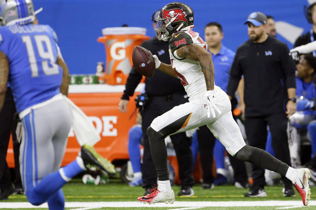 Tampa Bay Buccaneers defensive back Sean Murphy-Bunting returns an interception for a 70-yard t ...
