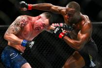 Kamaru Usman, right, fights Colby Covington during their welterweight title boutÊin UFC 24 ...