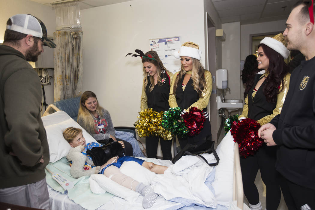 Knights Guard member Paige N., from left, Vegas Vivas! members Brittany L. and Alley B., center ...