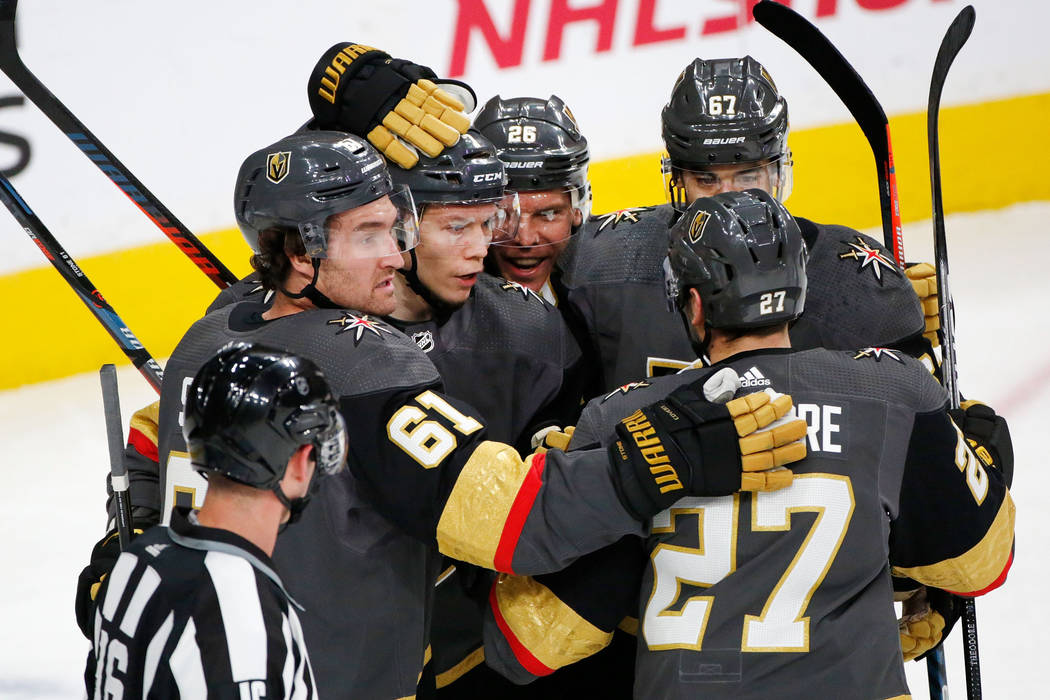 Vegas Golden Knights left wing Valentin Zykov (7), second from left, celebrates with his teamma ...
