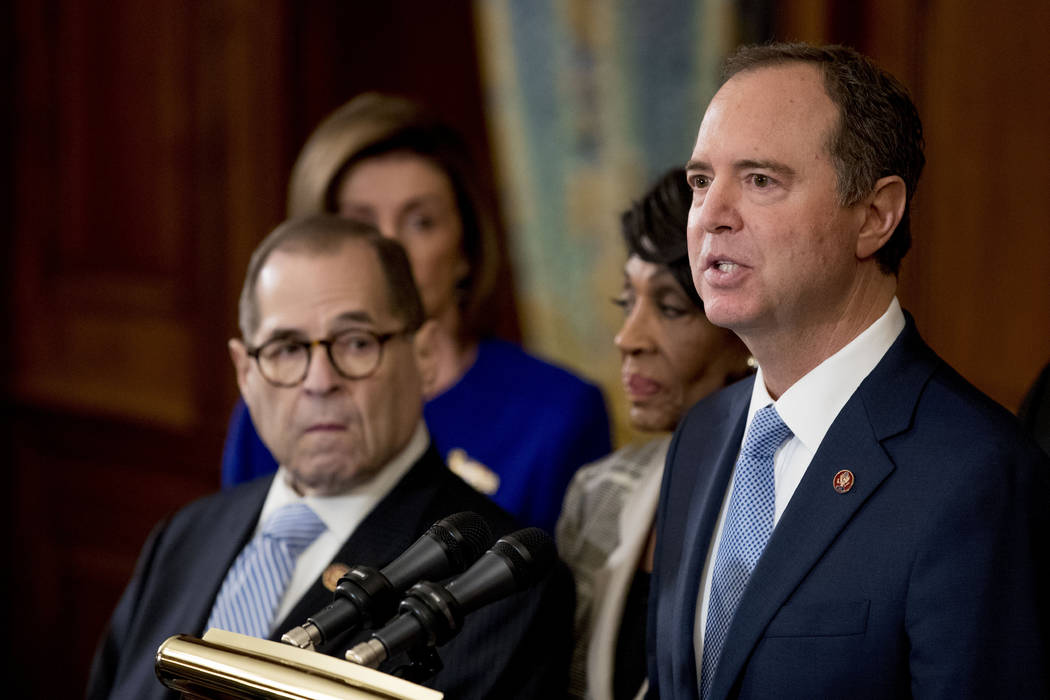 Rep. Adam Schiff, D-Calif., Chairman of the House Intelligence Committee, right, speaks with fr ...