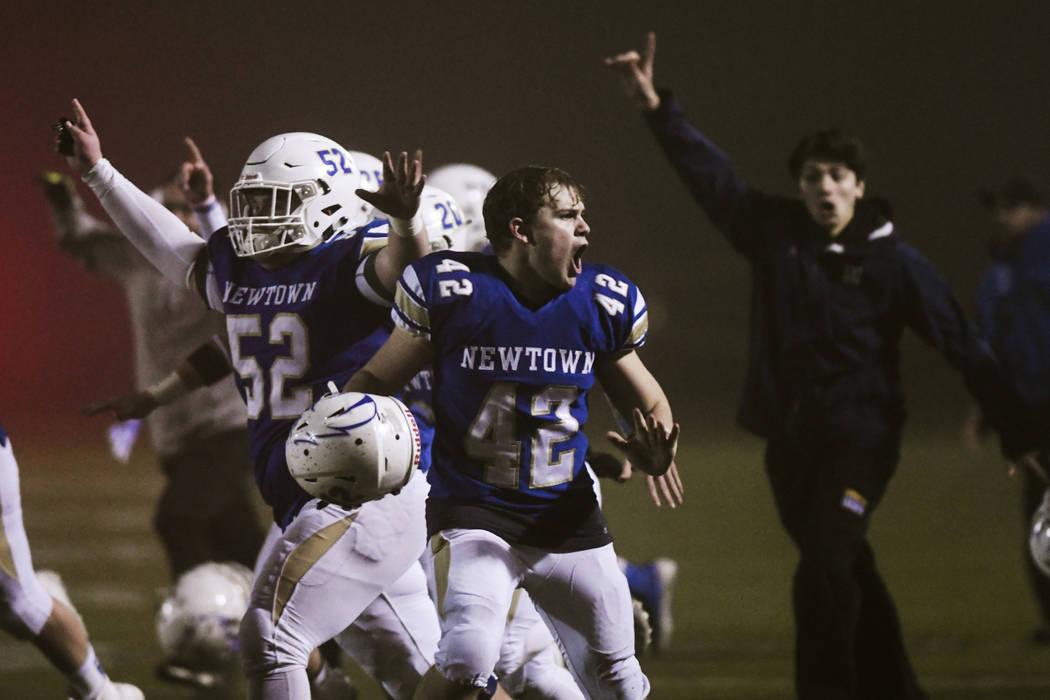 Newtown's Ben Pinto (42) reacts after the Newtown Nighthawks beat the Darien Blue Wave with a w ...