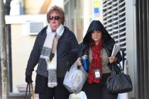 Pedestrians are bundled up as they walk along Lewis Avenue in cold weather on Wednesday, Nov. 2 ...