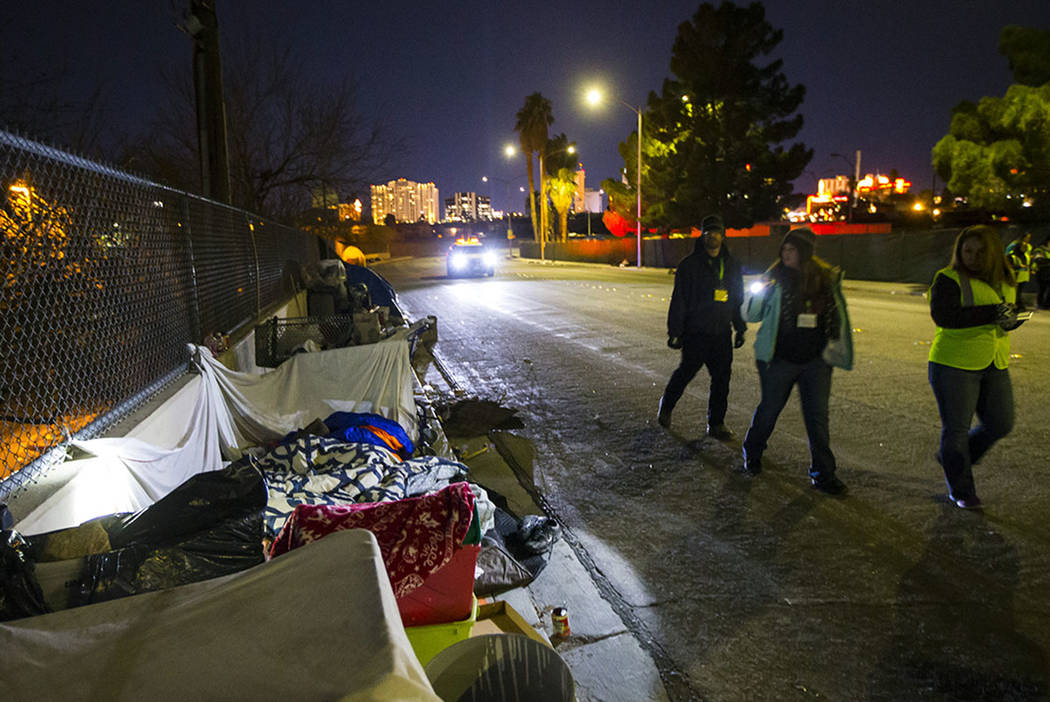 Volunteers find homeless people along Veterans Memorial Drive in downtown Las Vegas during the ...