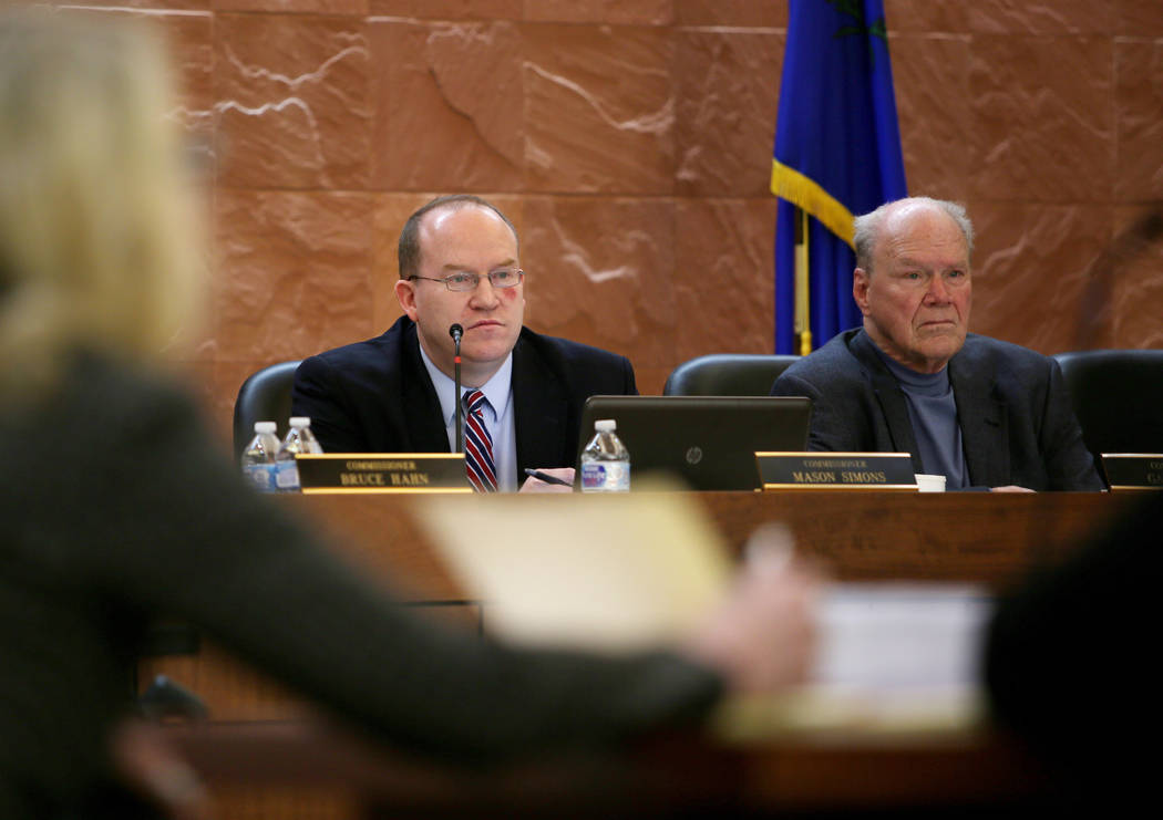 Nevada Judicial Discipline Commissioners Mason Simons, left, and Gary Vause, listen to an openi ...