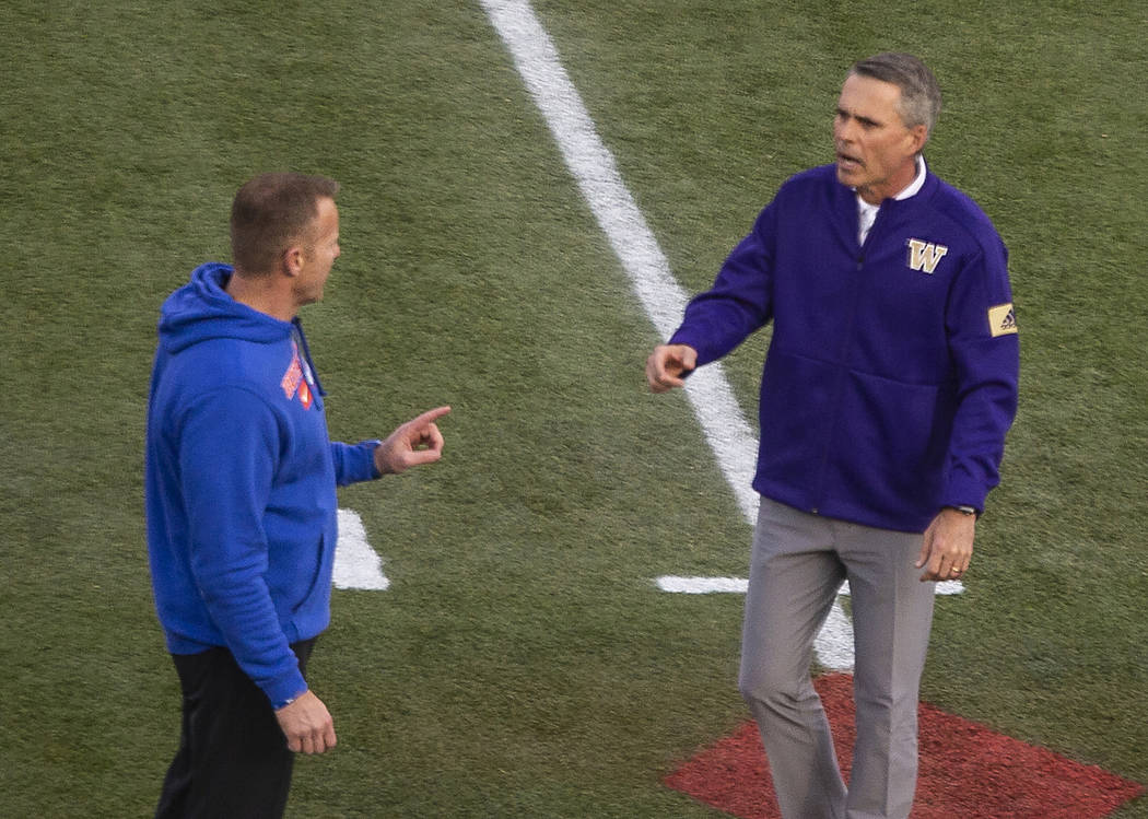 Boise State Broncos head coach Bryan Harsin and Washington Huskies head coach Chris Petersen ch ...