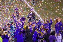 Confetti rains down on Washington Huskies cheerleaders while the trophy is presented after defe ...