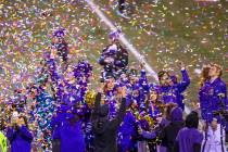 Confetti rains down on Washington Huskies cheerleaders while the trophy is presented after defe ...