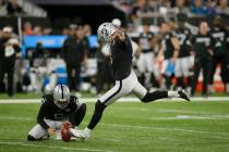 Oakland Raiders kicker Daniel Carlson (8) kicks a field goal out of the hold of punter A.J. Col ...