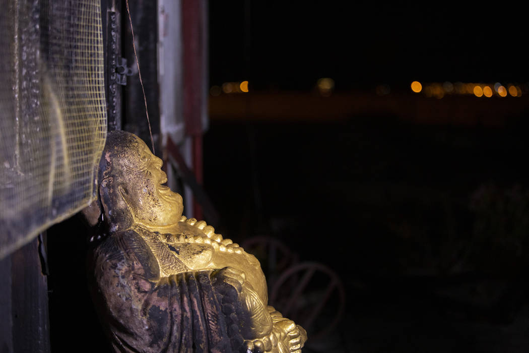 A Buddha statue has burn marks at the Thai Buddhist Temple-Las Vegas, Wat Buddha Pavana,&# ...