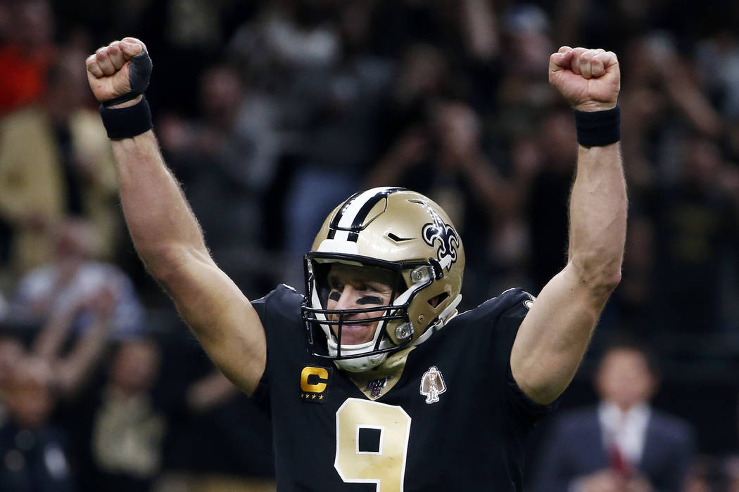 New Orleans Saints quarterback Drew Brees (9) celebrates his touchdown pass to tight end Josh H ...