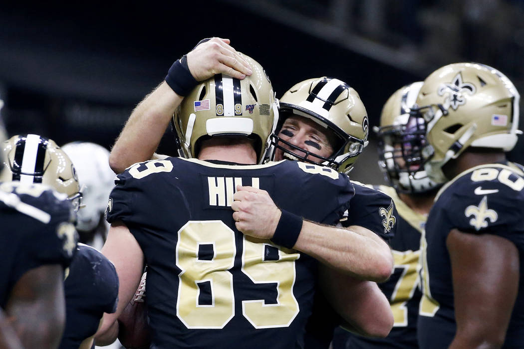 New Orleans Saints quarterback Drew Brees (9) celebrates his touchdown pass to tight end Josh H ...