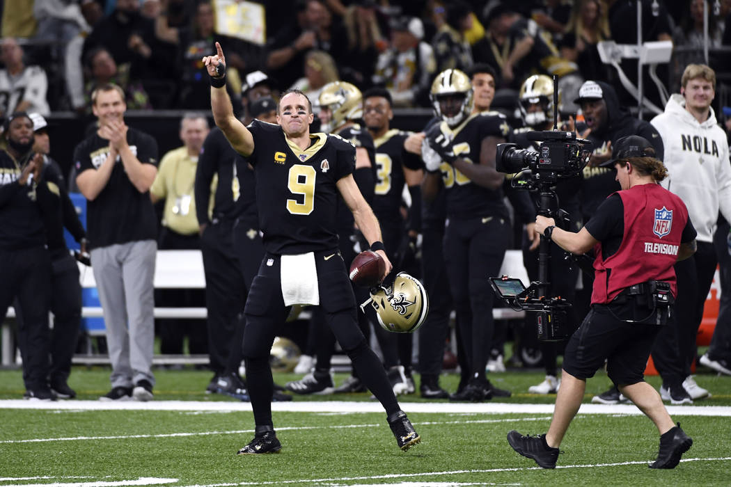 New Orleans Saints quarterback Drew Brees (9) celebrates his touchdown pass to tight end Josh H ...