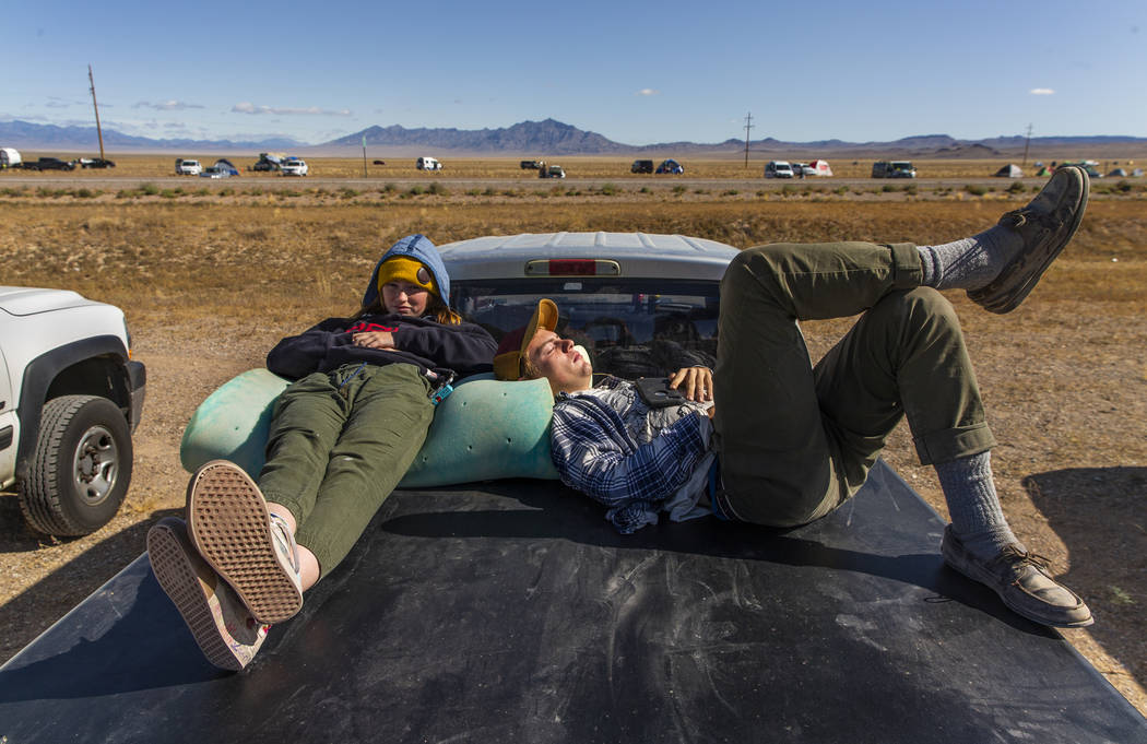Festivalgoers Adele and NK of Colorado catch a nap after a long night during the Alienstock fes ...