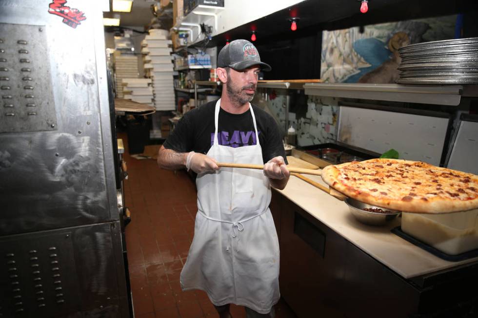 Will Stander prepares a grasshopper pizza at Evel Pie in Las Vegas, Tuesday, July 30, 2019. (Er ...