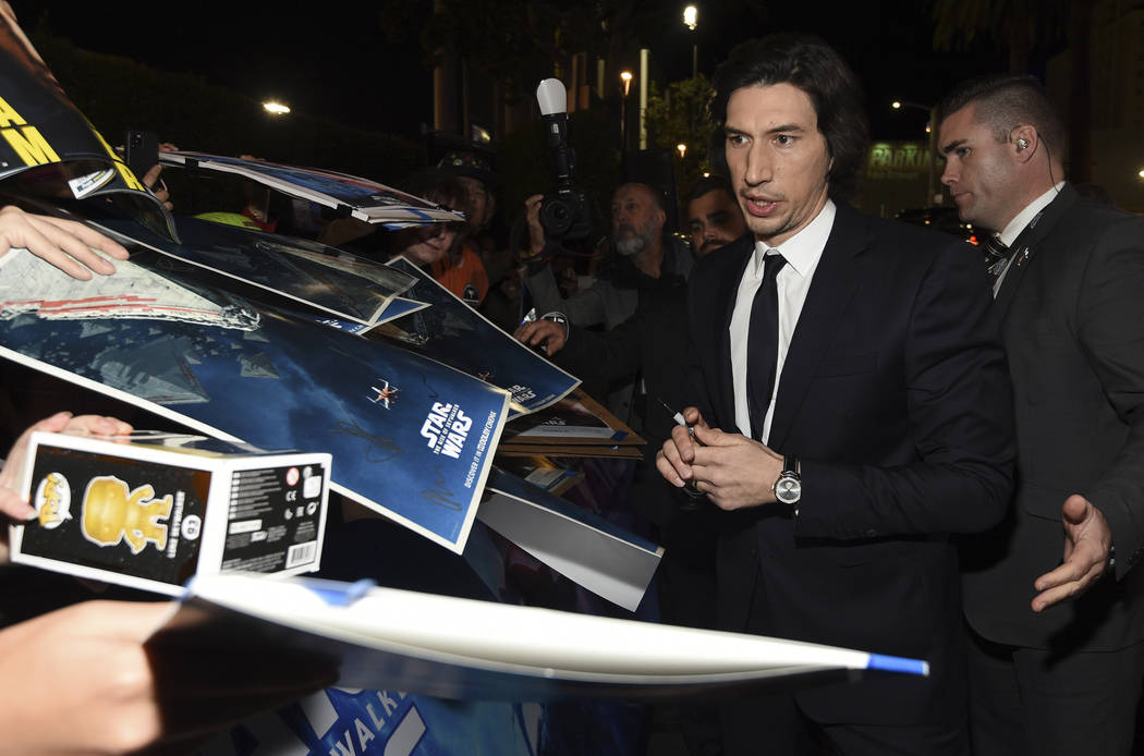 Adam Driver signs autographs as he arrives at the world premiere of "Star Wars: The Rise o ...