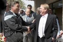 In this March 27, 2017, file photo, Oakland Raiders owner Mark Davis, right, shakes hands with ...