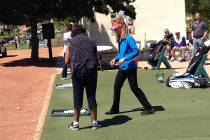 Nicole Dutt-Roberts, a PGA pro, in blue, instructs a stroke victim April 21, 2017 at Angel Park ...