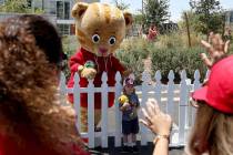 Braeden Klatt, 3, poses for a photo with PBS Kids television star Daniel Tiger during " Be My N ...