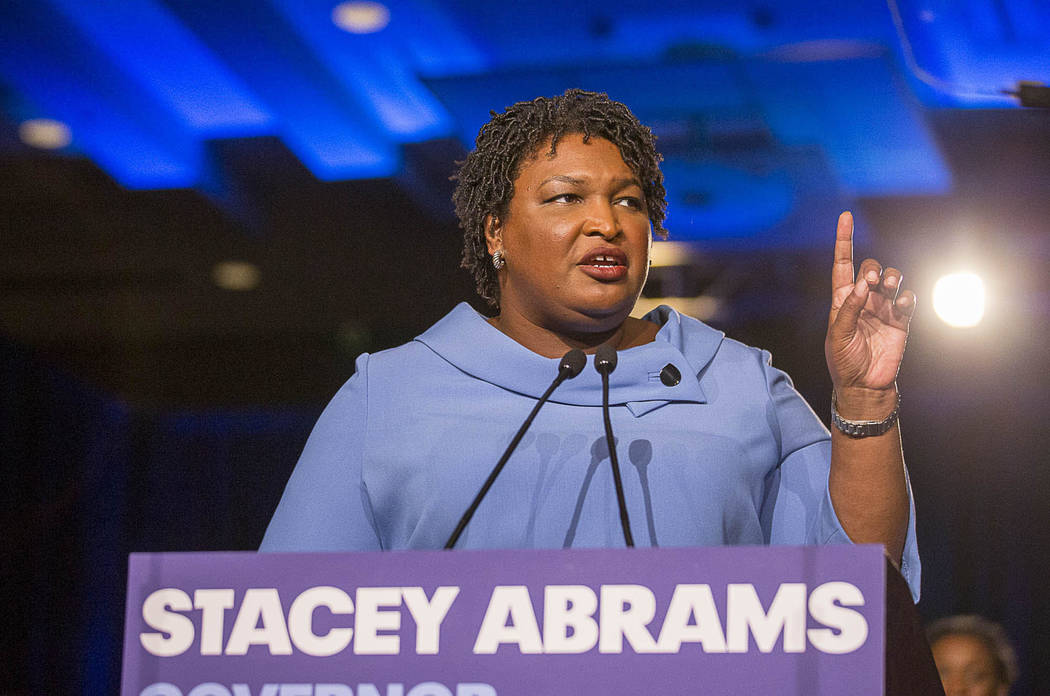 Democratic gubernatorial candidate Stacey Abrams speaks to her supporters during her election n ...