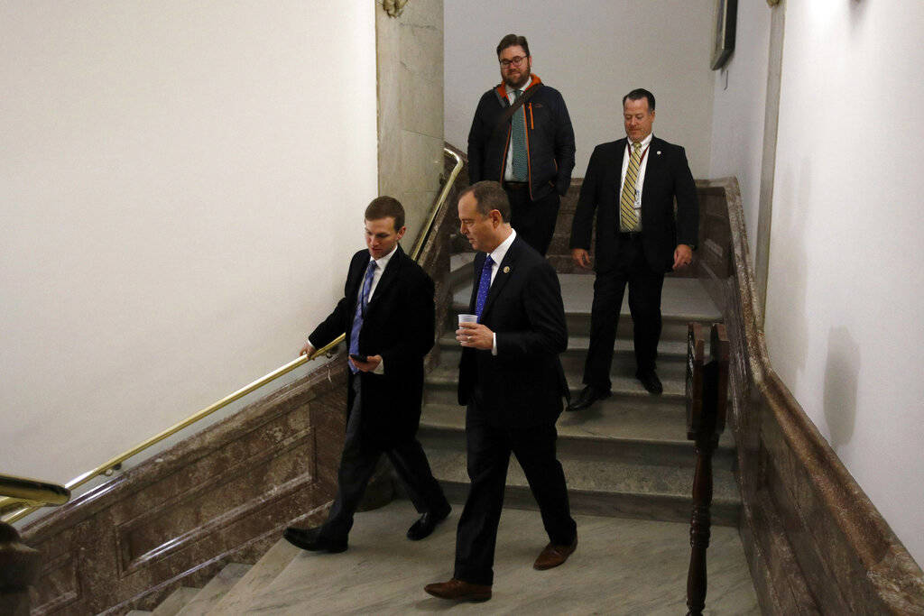 House Intelligence Committee Chairman Rep. Adam Schiff, D-Calif., center, speaks with a reporte ...