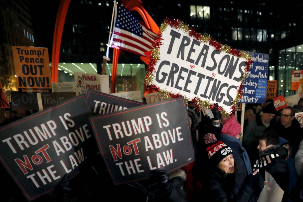 A crowd gathers on Federal Plaza for a protest against President Donald Trump on the eve of a s ...